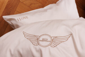 Luxury cotton bed linen with embroidery design of wings and i love eco essentials